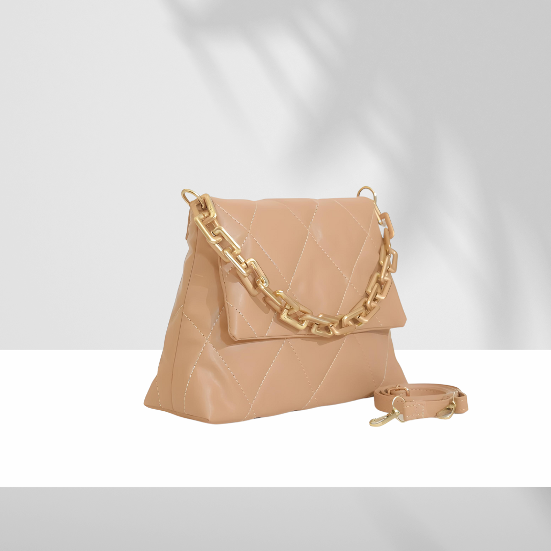 Quilted brown faux leather handbag with gold chain strap and detachable shoulder strap on white background