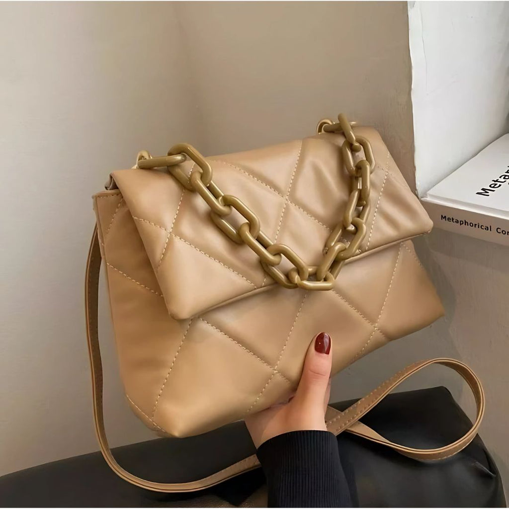 Beige quilted faux leather handbag with chunky chain strap, stylish and spacious for everyday use.