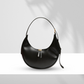 Lyana Claudia Bag Black, sleek U-shaped synthetic leather hobo with dual zippers and adjustable shoulder strap.