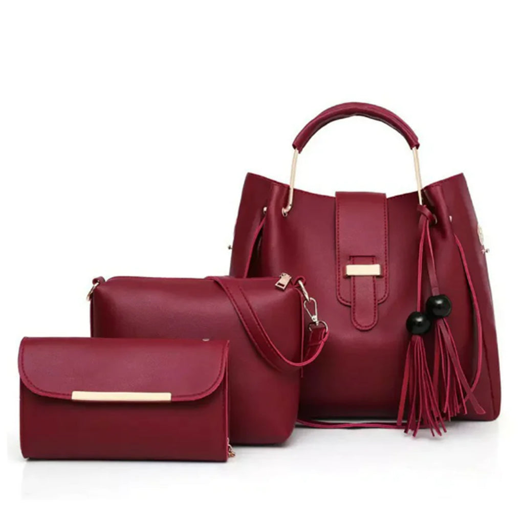 Three-piece maroon handbag set with top-handle bag, crossbody bag, and matching wallet clutch in premium synthetic leather