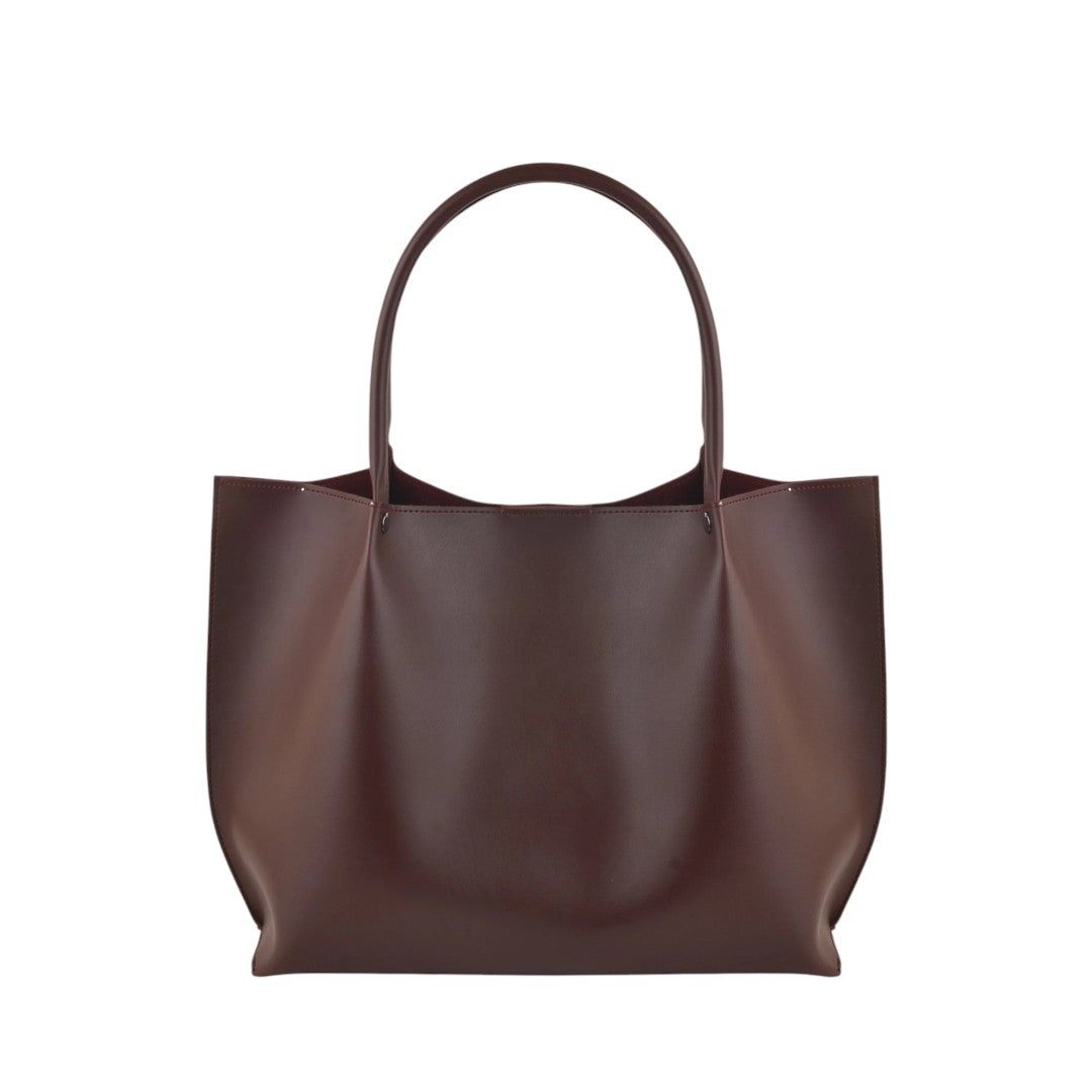 Black faux leather Cedar Tote bag with two handles, one main compartment, and an interior zipper pocket.